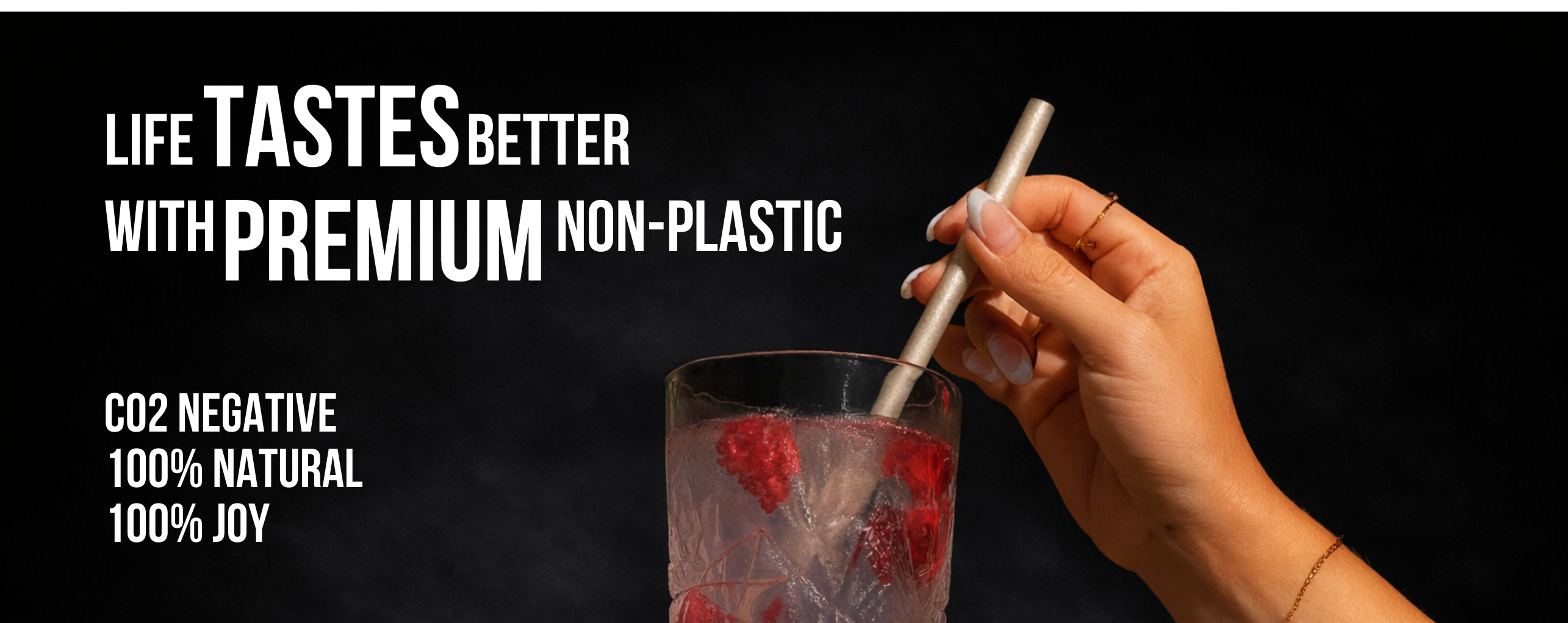 Cyclups Plantastiq 'Life Tastes Better with Premium Non-Plastic' banner - hand holding a PLQ straw in a drink, CO2 negative and 100% natural