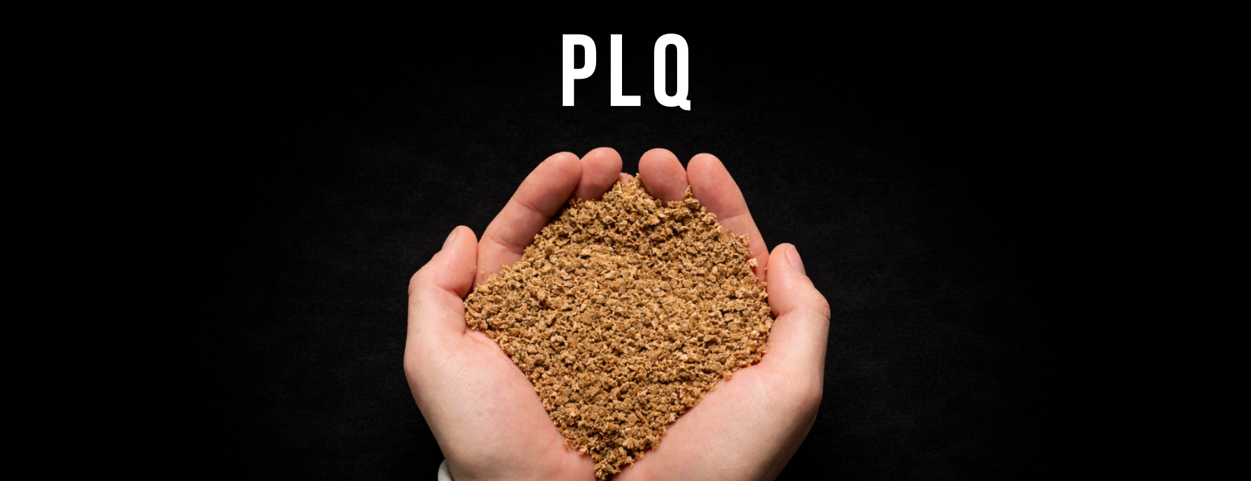 Hand holding a scoop of PLQ wheat-based compostable material powder - Cyclups Plantastiq raw material