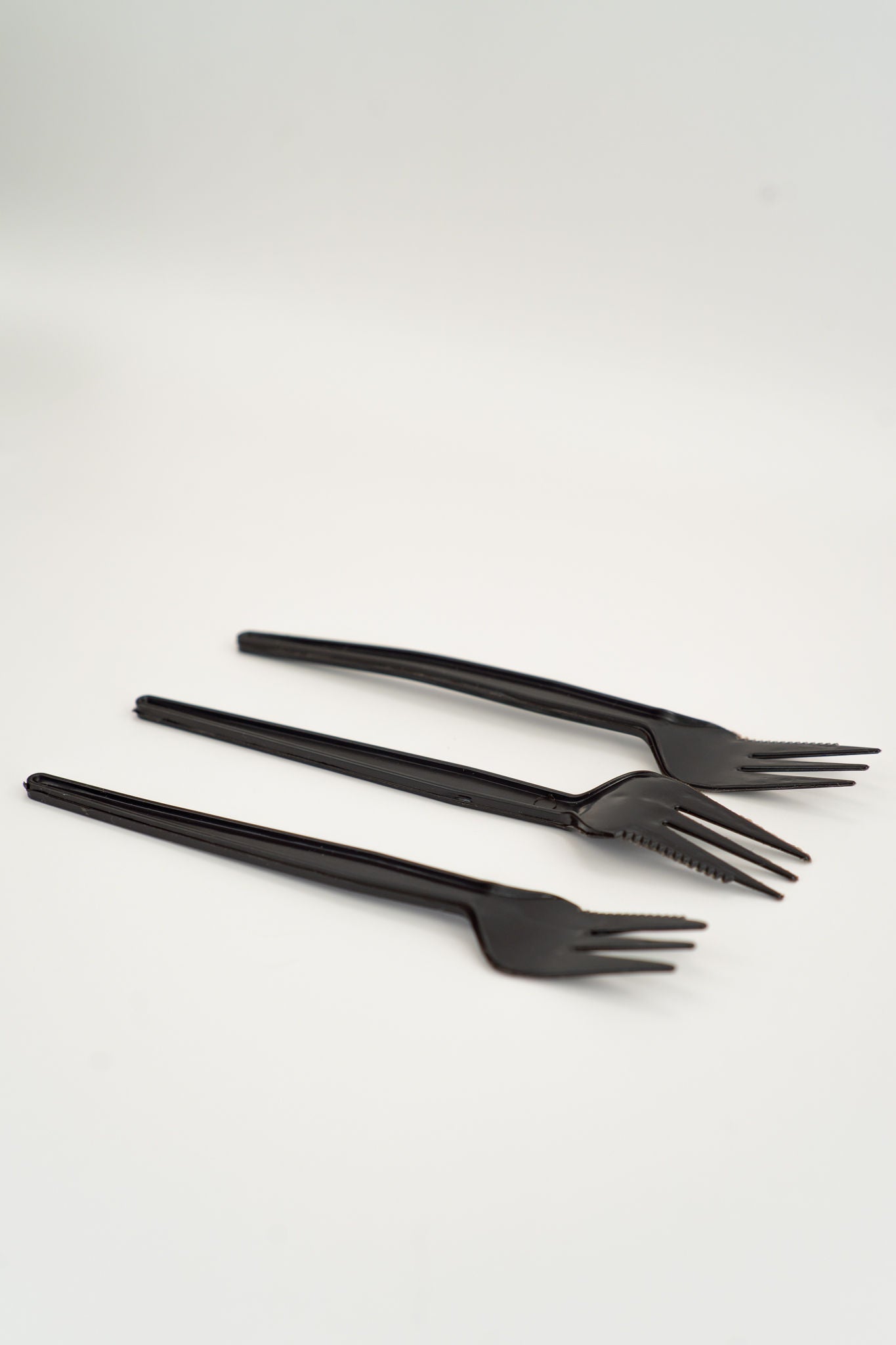 Set of three black compostable PLQ forks on a white background - Cyclups Plantastiq non-plastic cutlery made from wheat